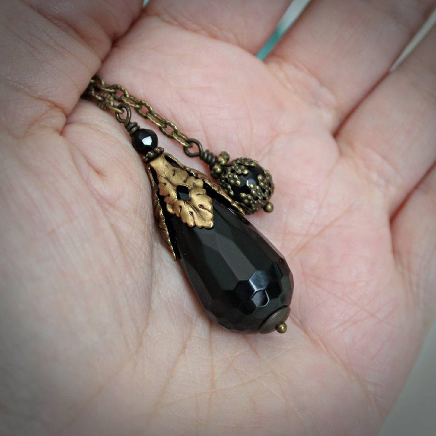 Faceted Black Onyx Pendulum.
