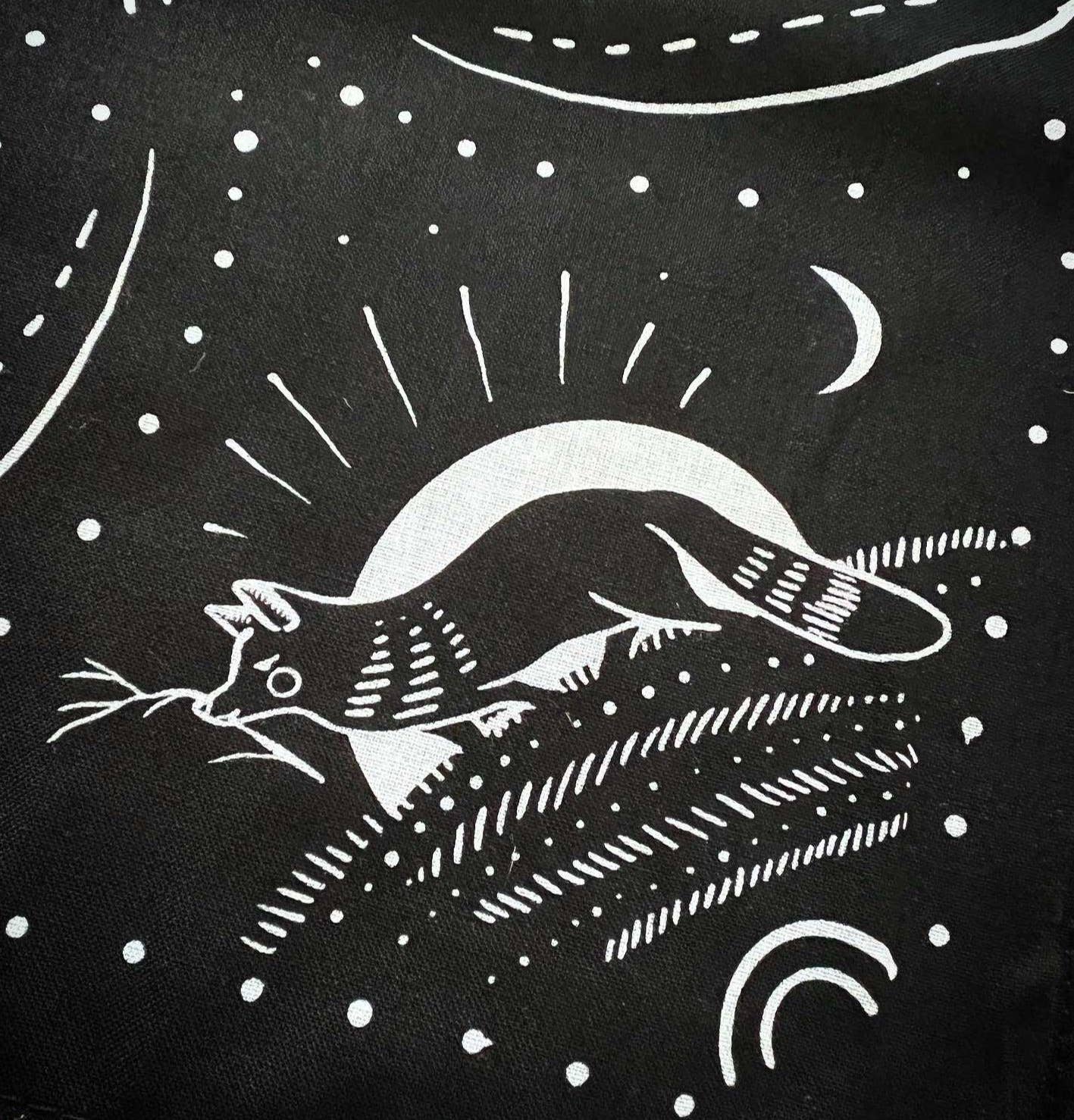 Black fabric with white cat and moon design