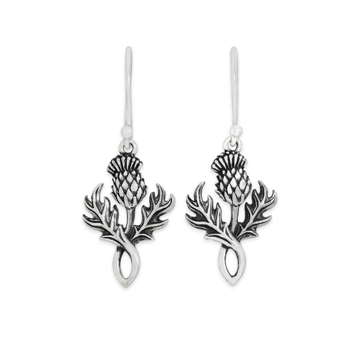 A pair of silver drop earrings featuring an oxidized thistle design, shown against a plain white background.