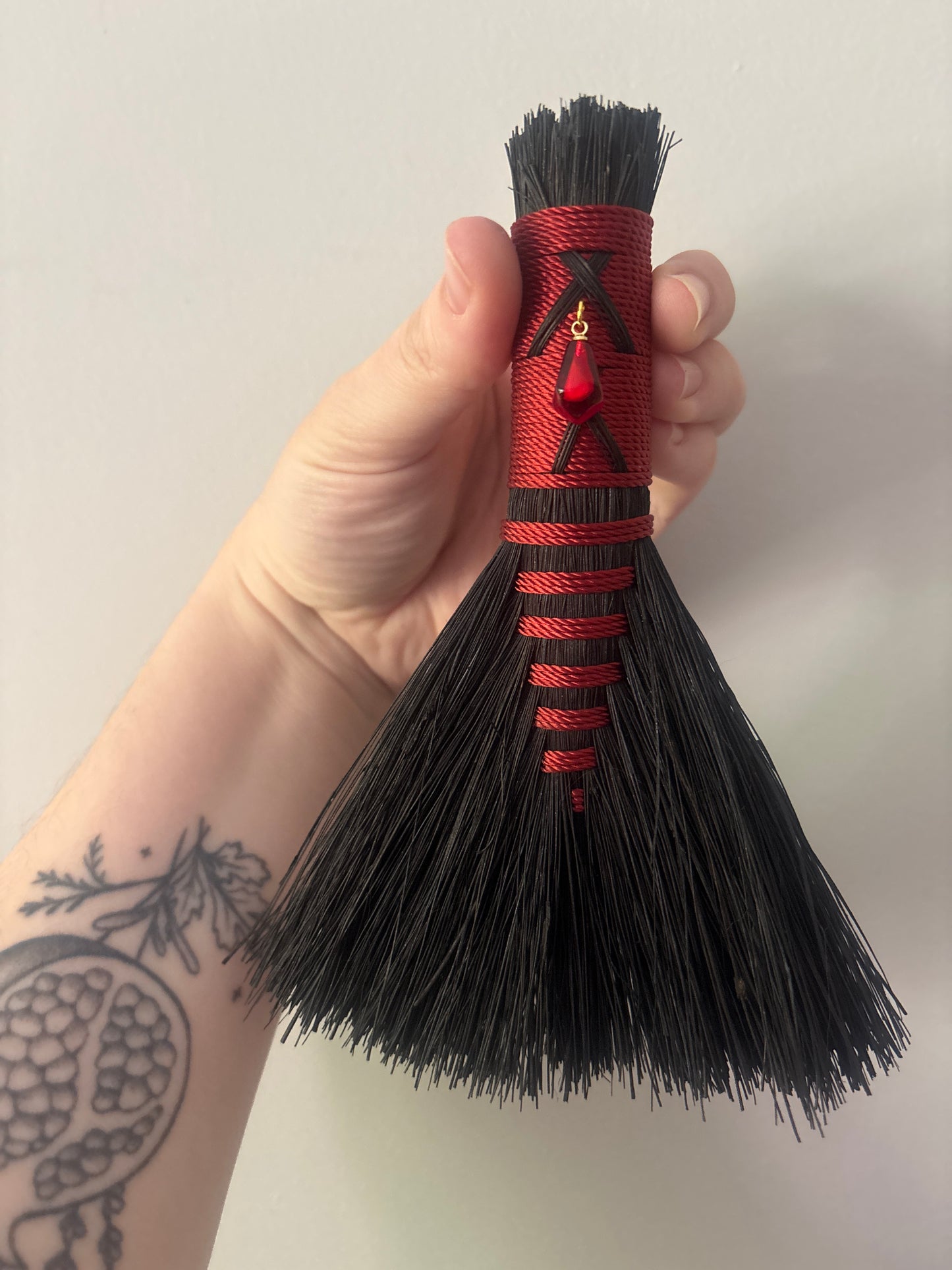 Black and Red Handbroom with Pomegranate Aril Talisman 6"