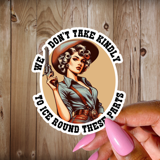 Sticker with a woman holding a gun and text on a wooden background