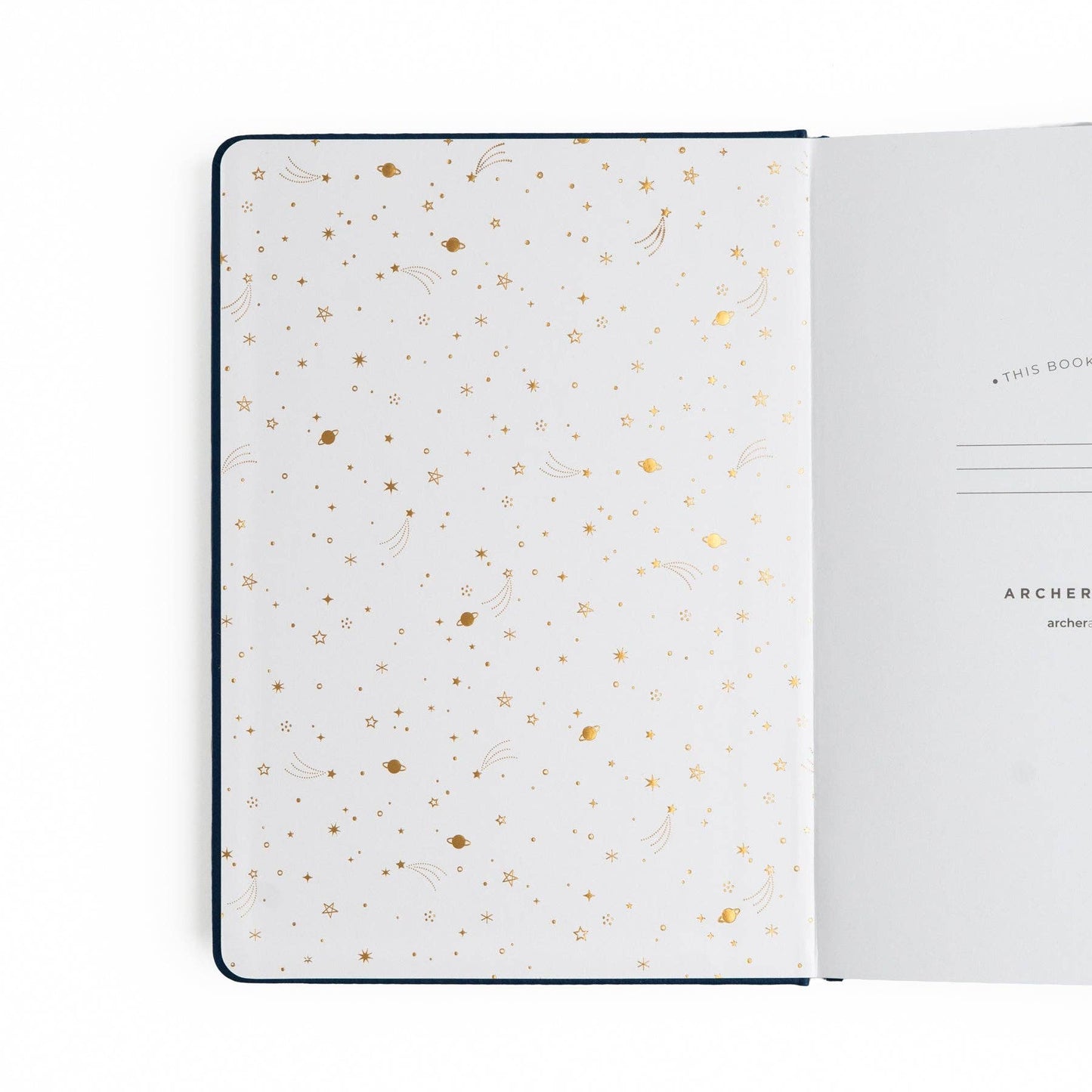 Open notebook with gold dot pattern on white pages