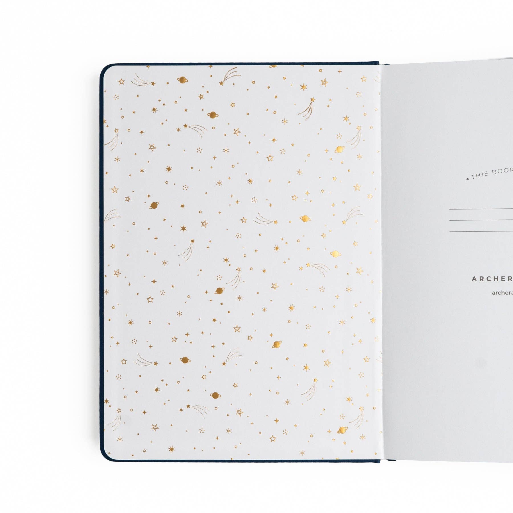Open notebook with gold dot pattern on white pages
