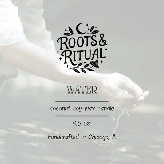 Roots & Ritual candle label with text on a blurred background