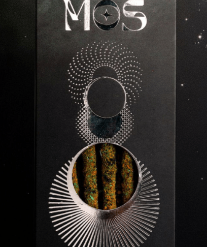 Incense box with metallic print on a black background.