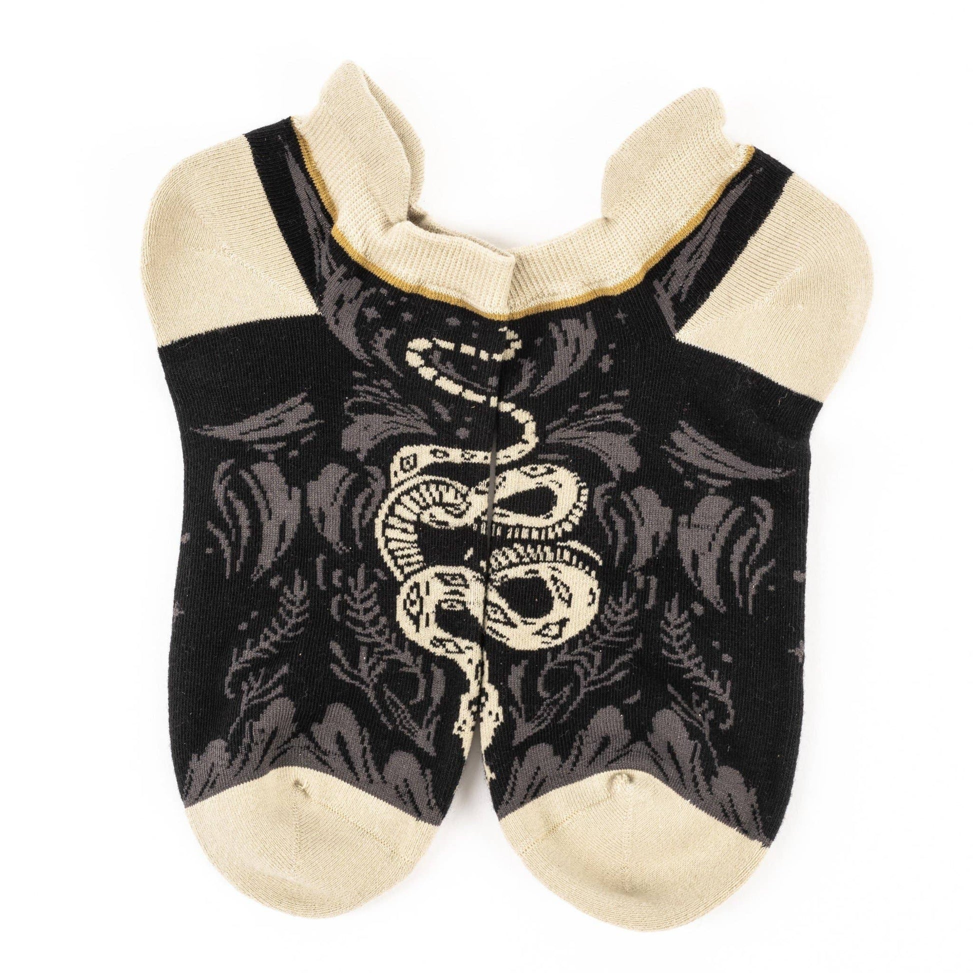 Black ankle socks with white snake design on a white background