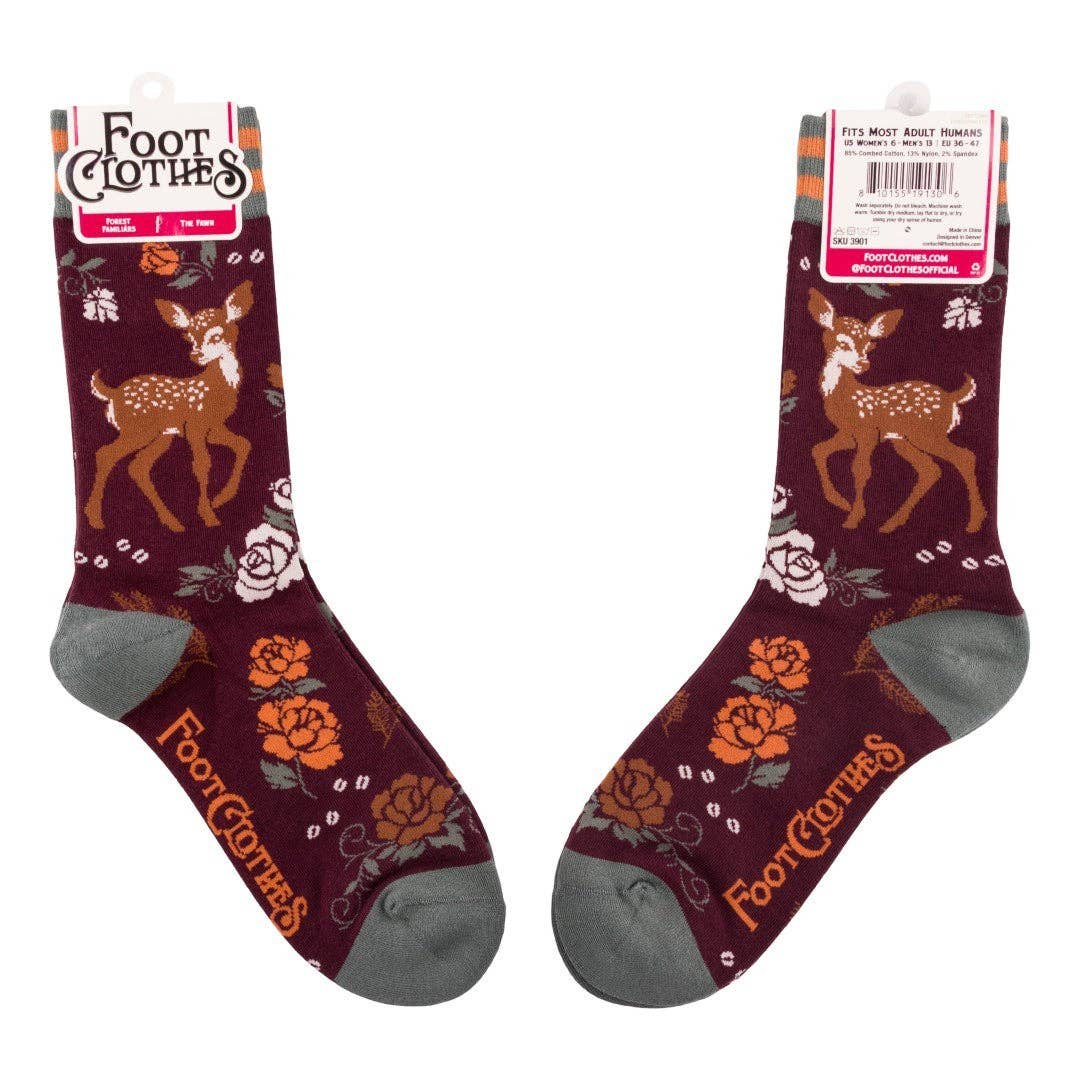 Pair of maroon socks with deer and floral patterns on a white background