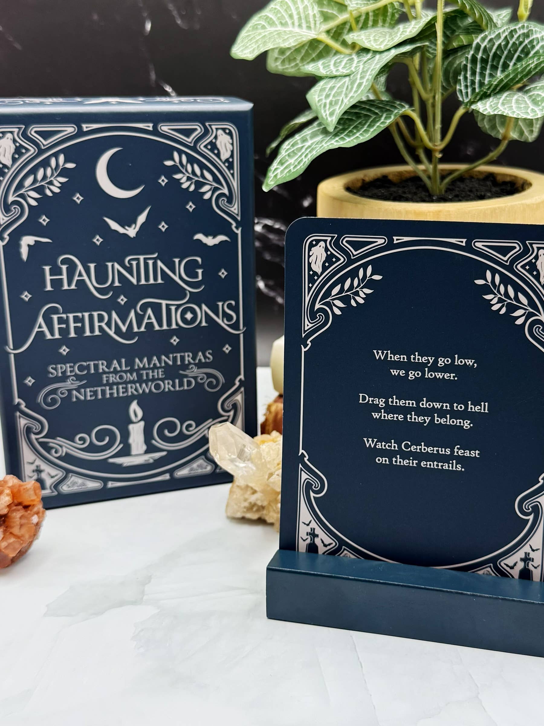 Haunting Affirmations card set with decorative elements on a white surface.