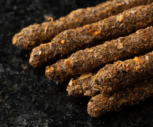 Close-up of dried roots or herbs on a dark background