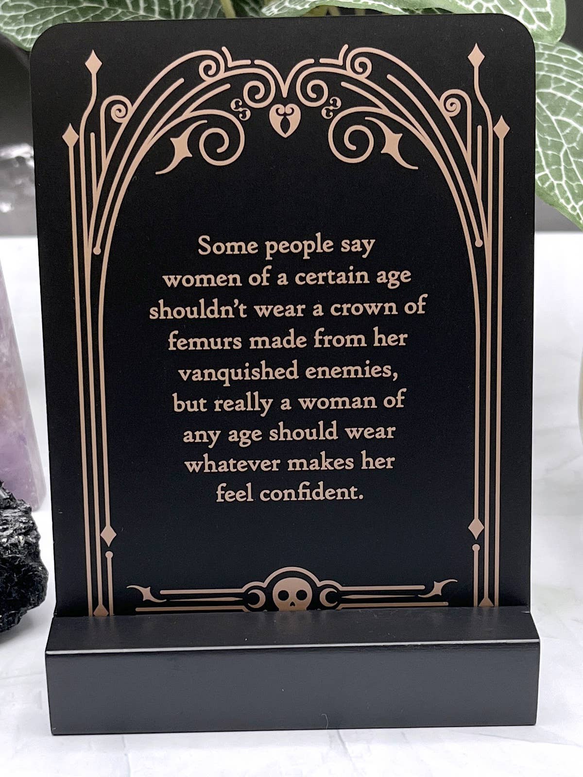 Decorative card with a motivational quote on a black background