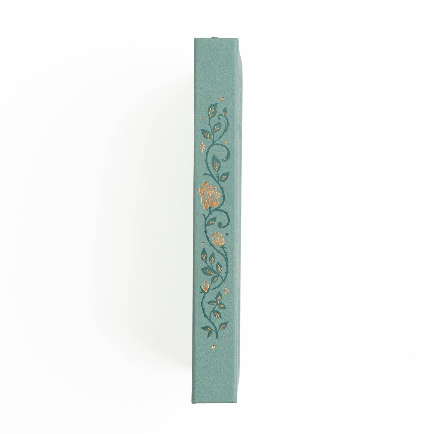 Teal book with floral design on a white background