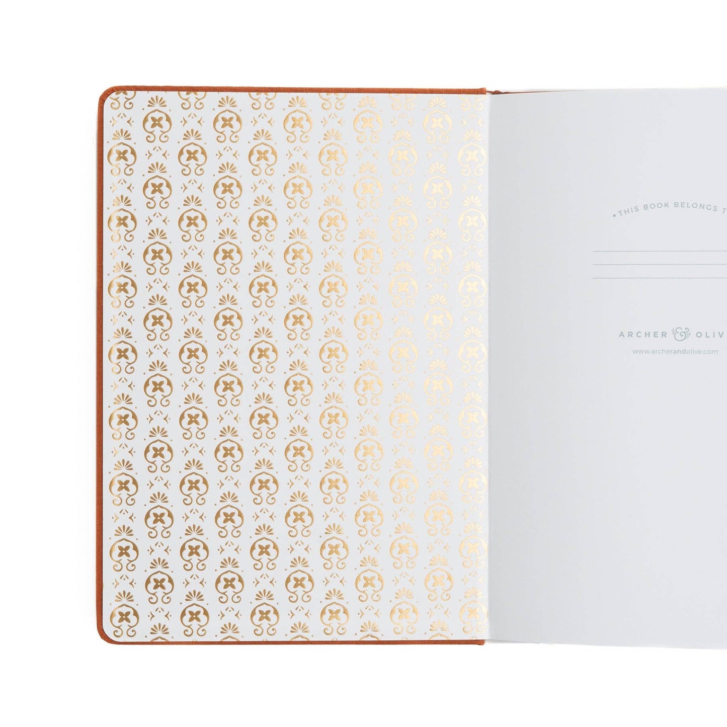 Notebook with gold geometric pattern on white pages, brand 'Archer & Olive' visible.