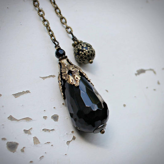 Faceted Black Onyx Pendulum.