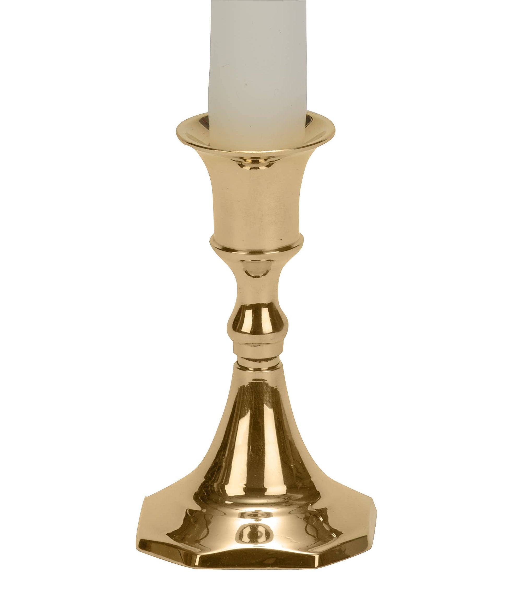 Gold candle holder with a white candle on a white background