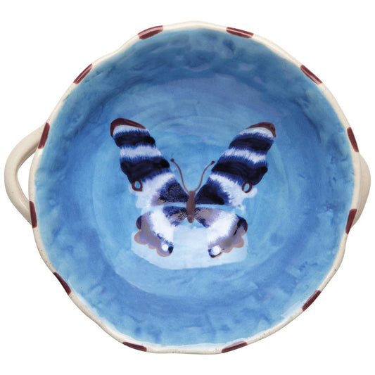 Ceramic bowl with a blue butterfly design on a white background