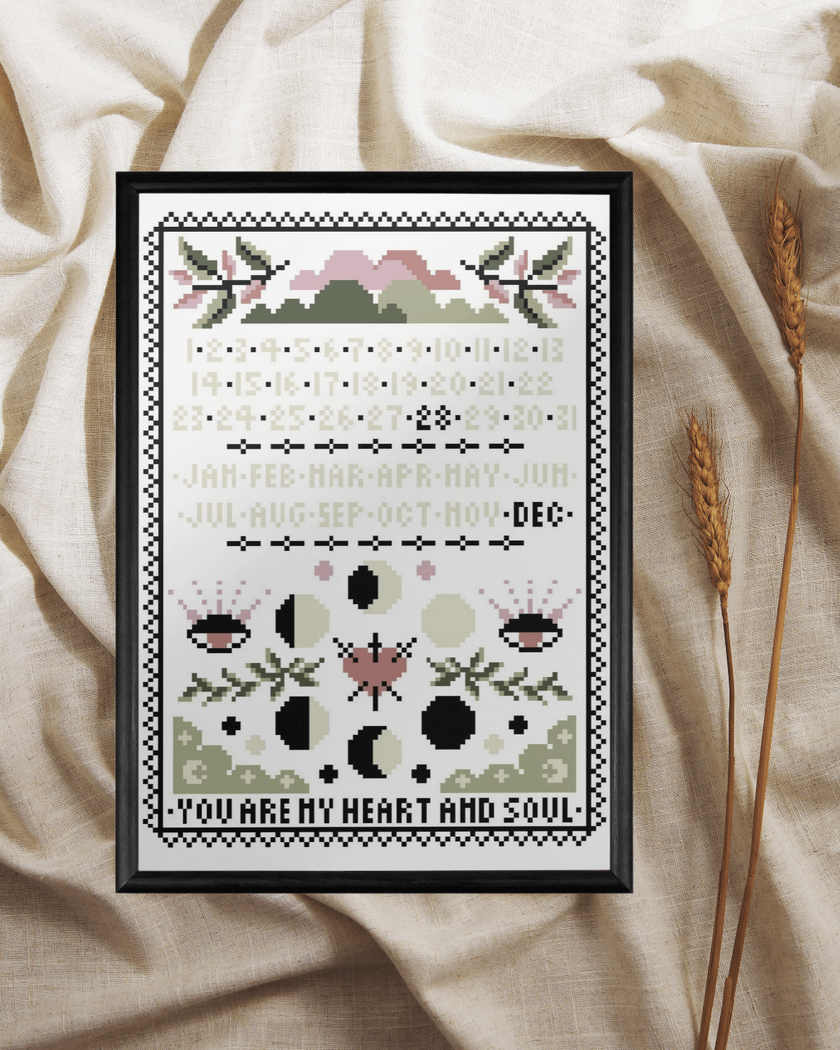 Decorative cross-stitch pattern with floral and geometric designs on a beige fabric background.