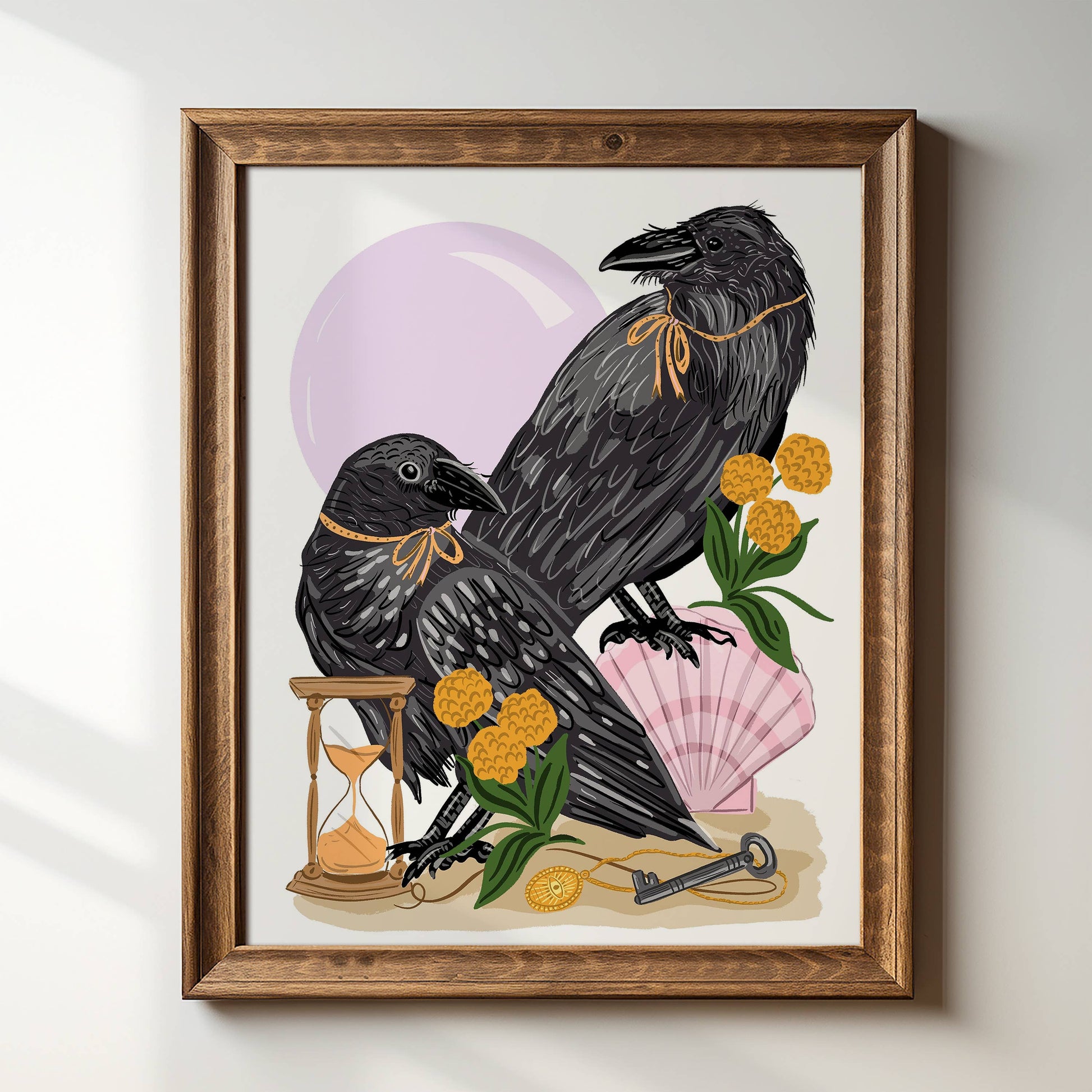 Two black crows with colorful flowers in a wood frame.