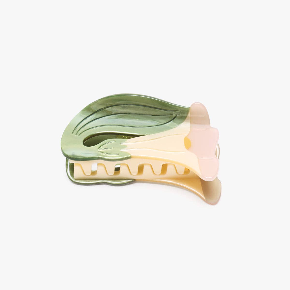 A translucent hair claw clip shaped like a stylized flower, featuring a green leaf-like top section, a pale yellow center, and a soft pink petal-like side, shown on a plain light gray background.