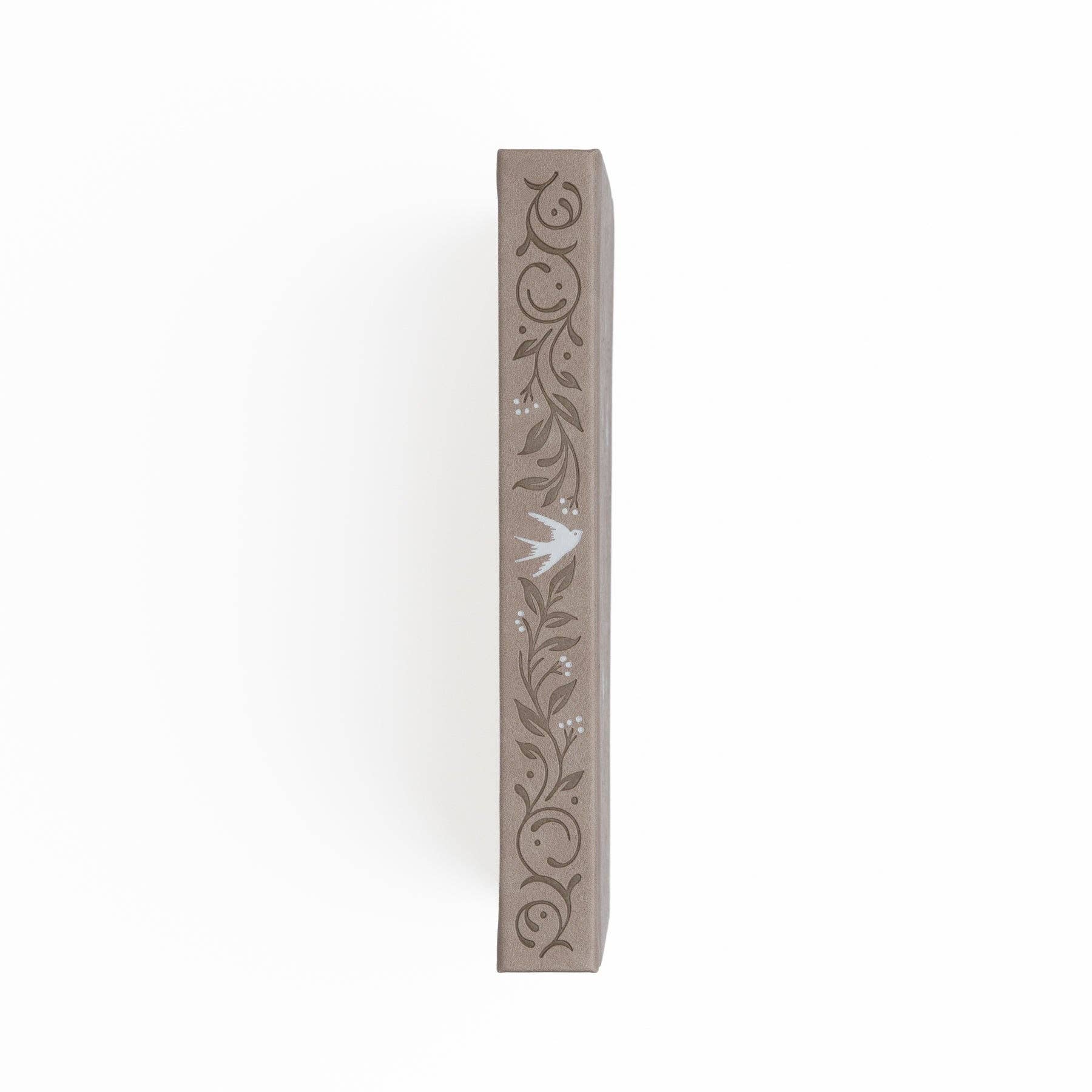 Decorative planner spine with floral patterns on a white background