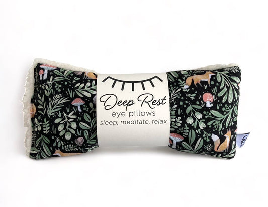 Deep Rest eye pillows with nature-themed design on a white background