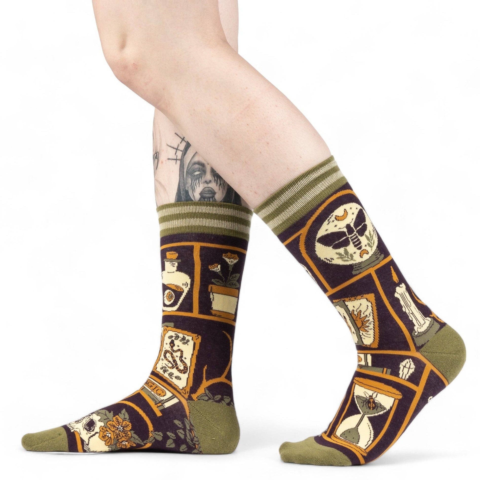 Colorful patterned socks worn on a white background