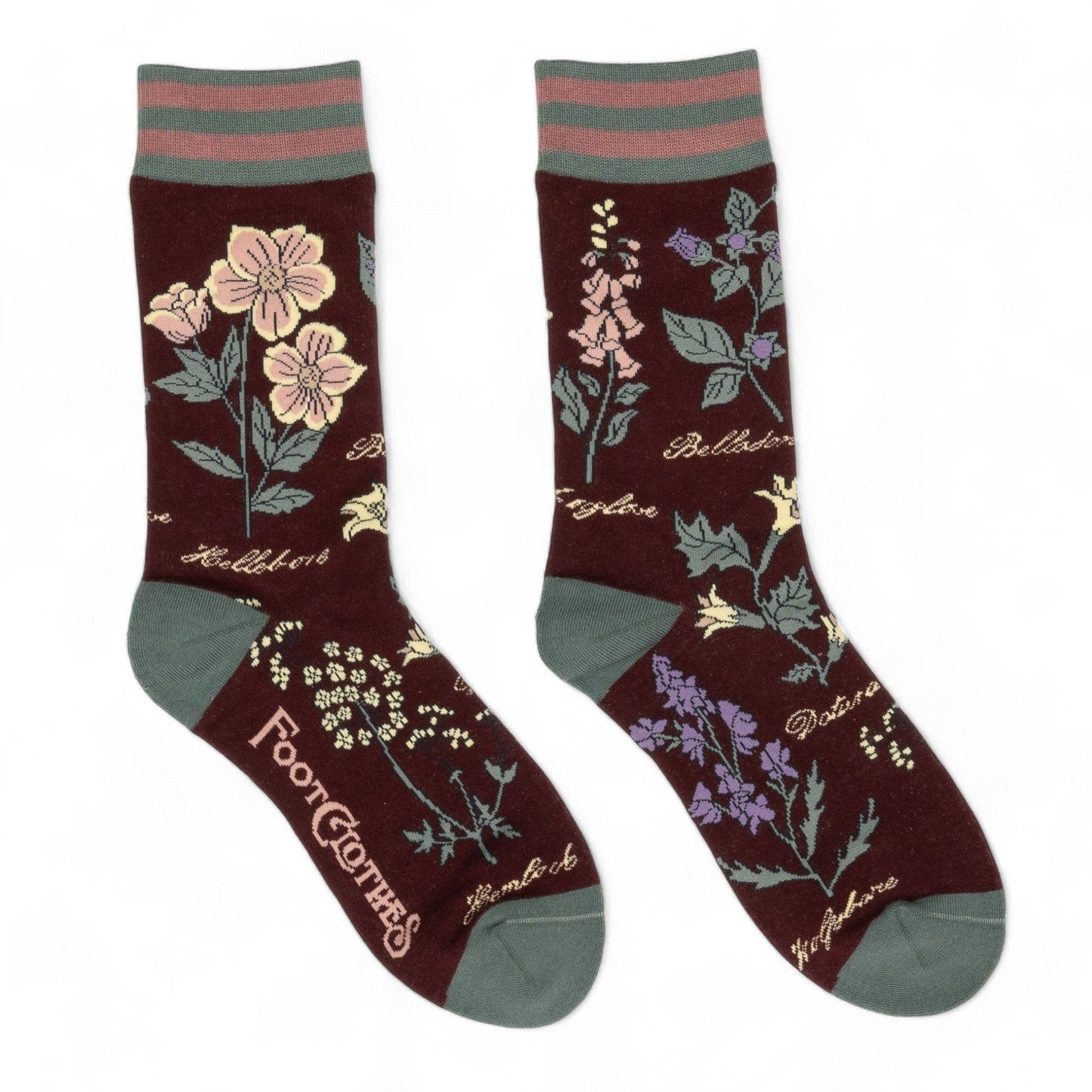 Pair of socks with floral designs and text on a white background