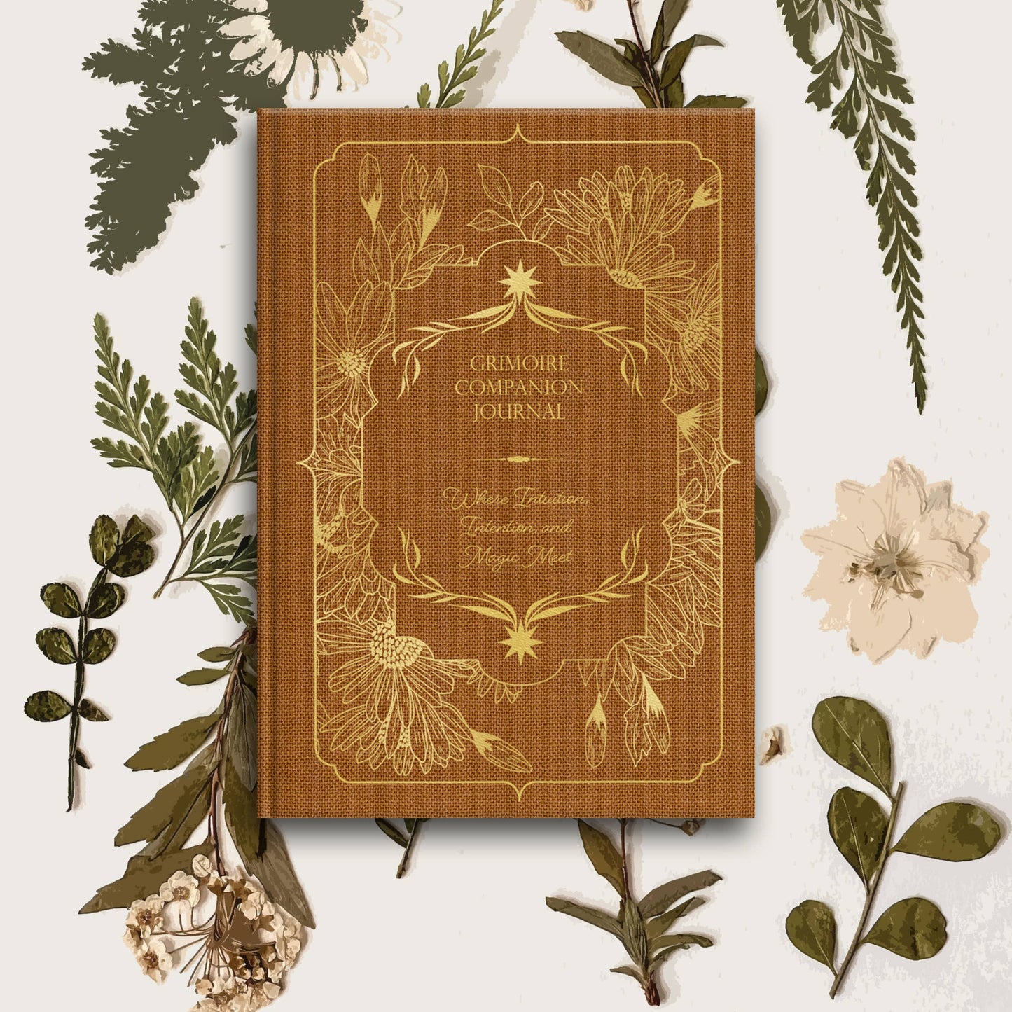 Brown journal titled 'Grimoire Companion Journal' surrounded by green leaves and flowers on a white background