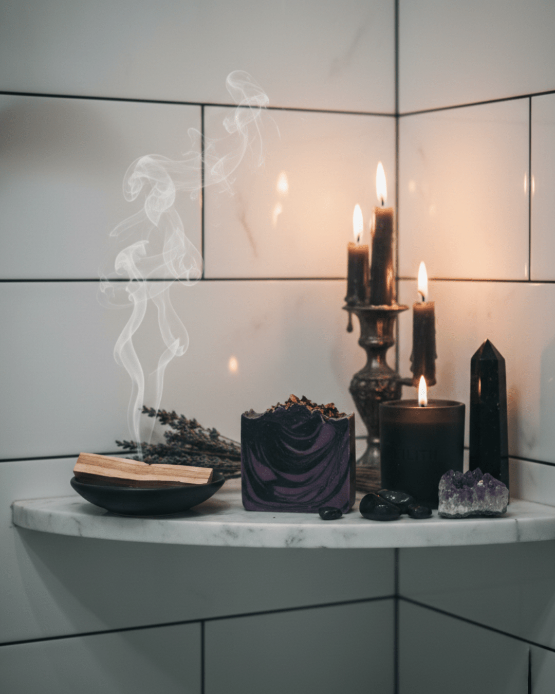 Decorative shelf with candles, incense, and crystals against a tiled wall.