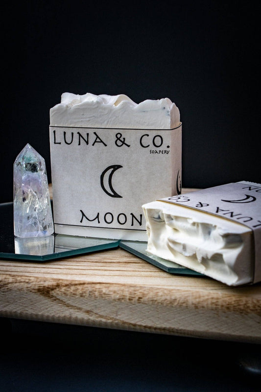 Luna & Co. soap with crystal on a wooden surface