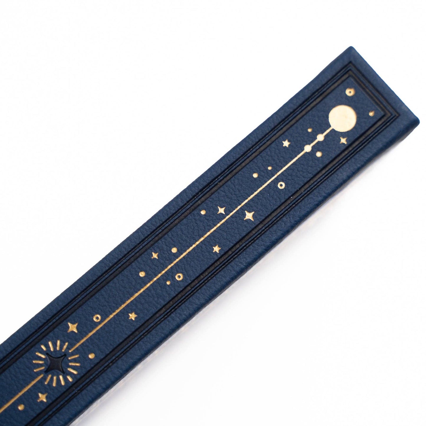 Blue box with gold star and moon designs on a white background