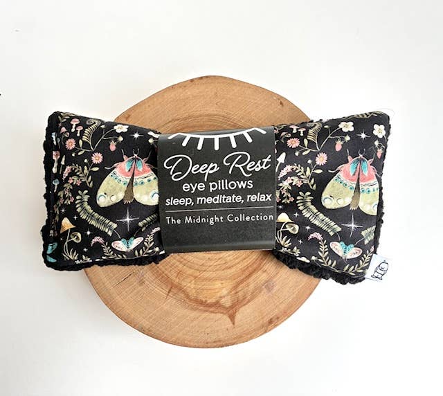 Deep rest eye pillow with moth fabric and black sherpa lining.
