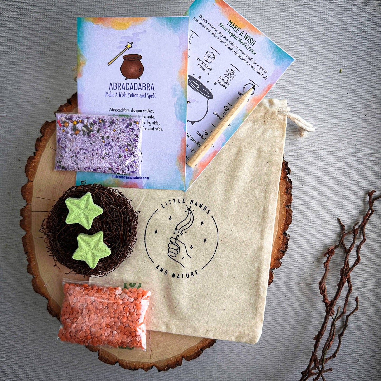 Witchcraft-themed items including a bag, star-shaped objects, and books on a wooden surface.