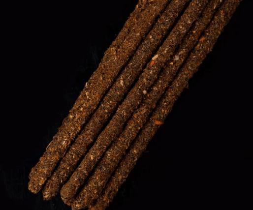 Dark brown sticks on a black background