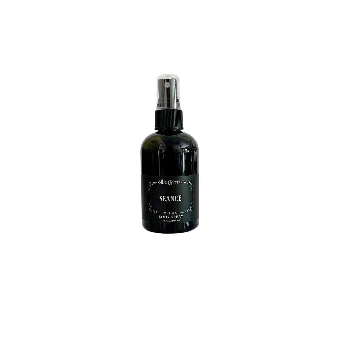 A black glass spray bottle of Seance Vegan Body Spray by The Alchemist Shop, centered on a plain white background.