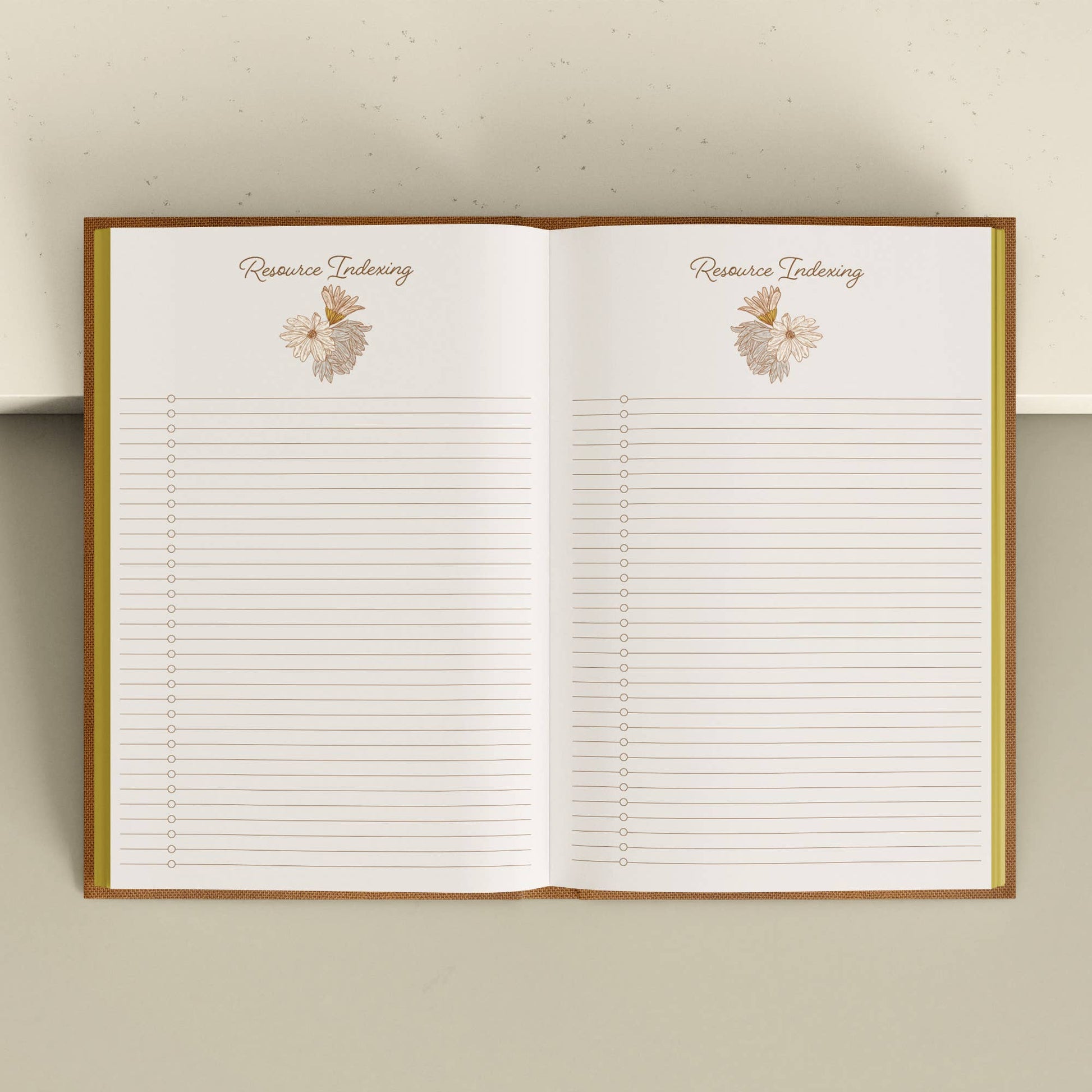 Open notebook with lined pages and floral designs on a light background