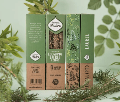 Three green boxes with branding and product details on a green leafy background