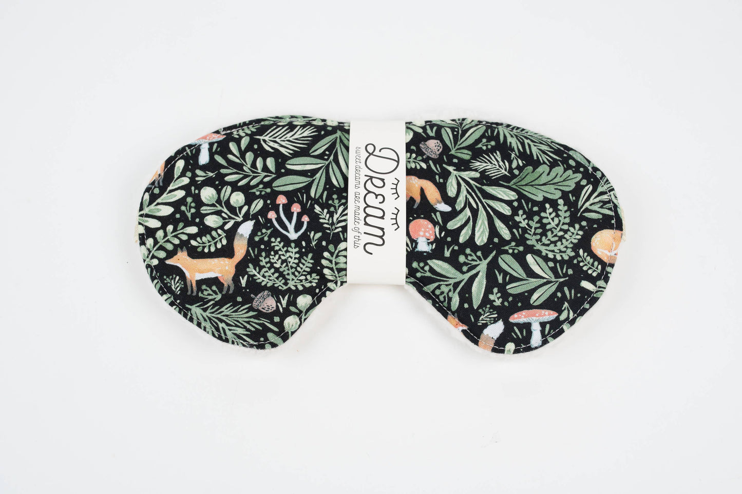 Sleep mask with nature-themed design on a white background