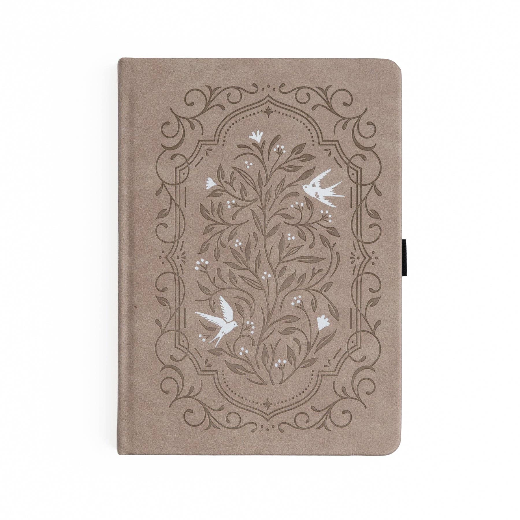 Beige notebook with floral and bird design on a white background