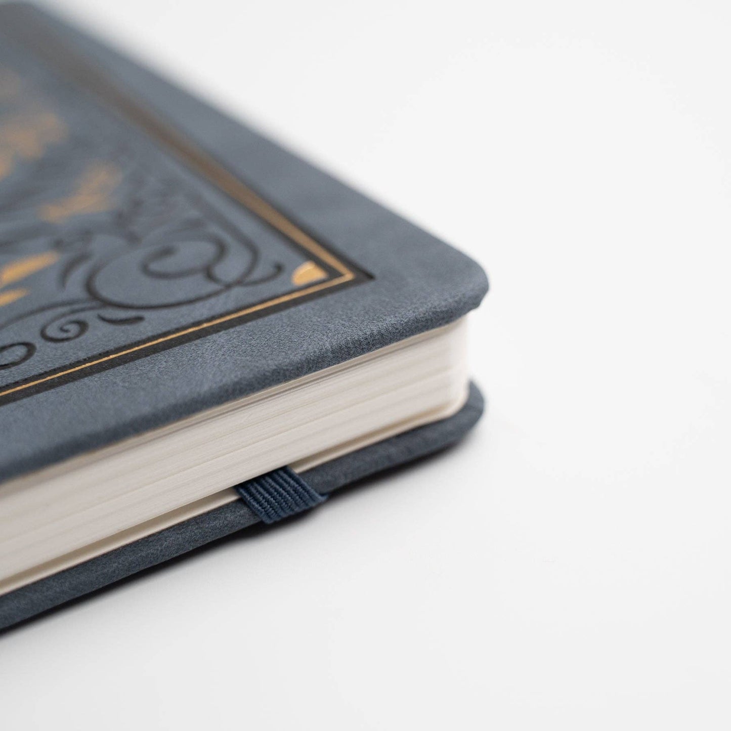 Gray notebook with decorative cover on a white background