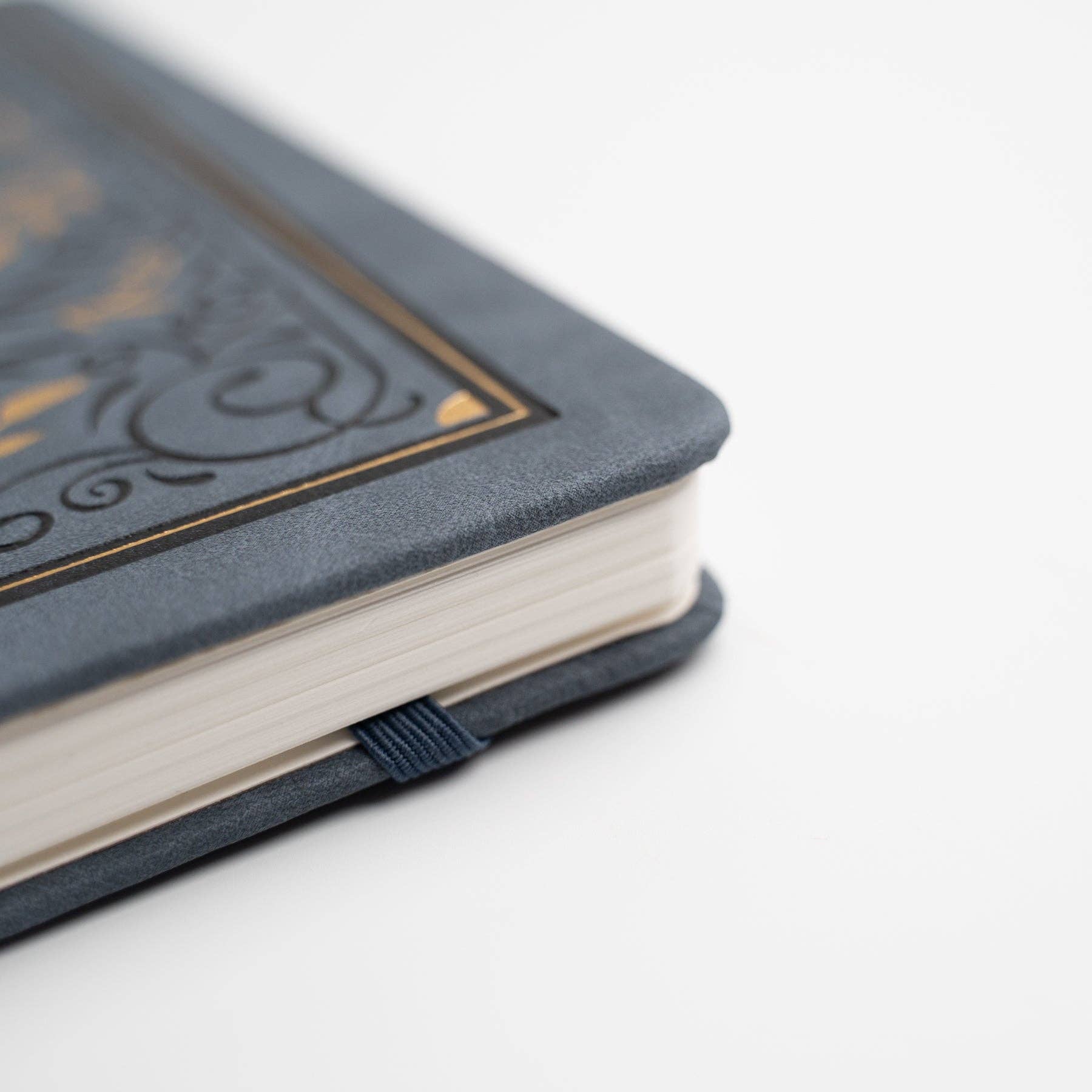 Gray notebook with decorative cover on a white background