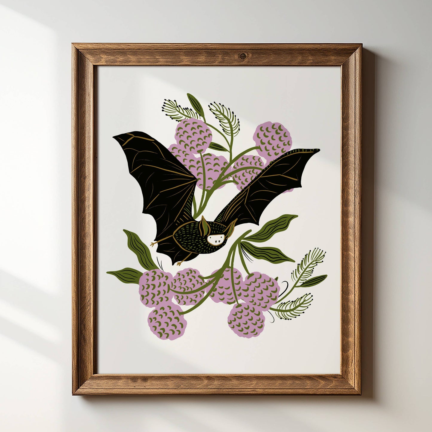 Tara Reed Vintage Bat art print in gold frame on white wall.