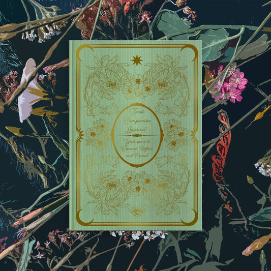 Tarot journal with floral patterns on a dark floral background