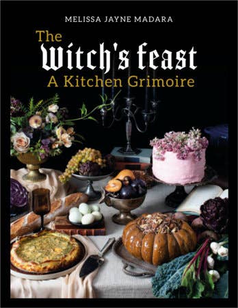 Book cover of 'The Witch's Feast: A Kitchen Grimoire' with a table setting and floral arrangements.