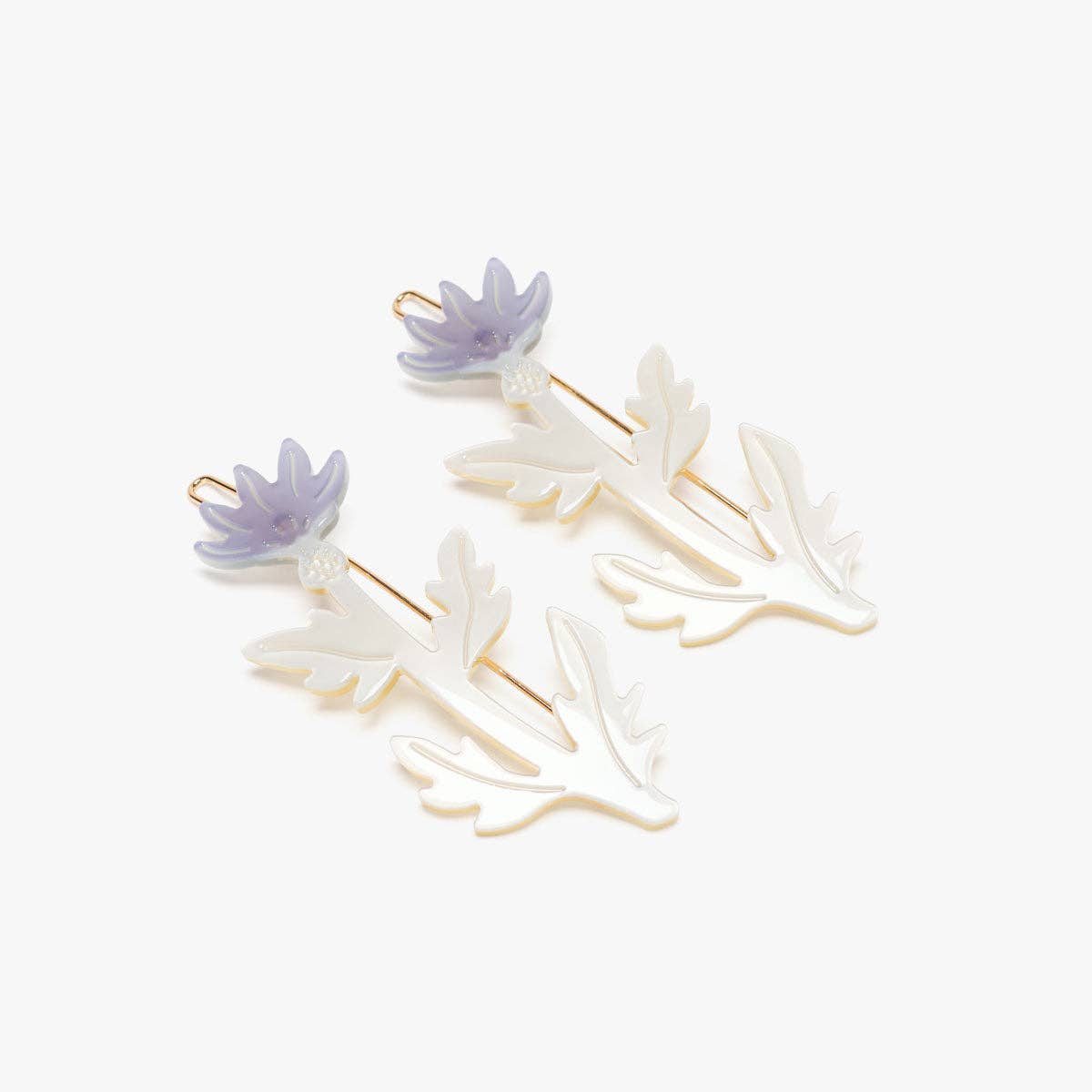 Set of floral hair clips with purple flowers on a white background