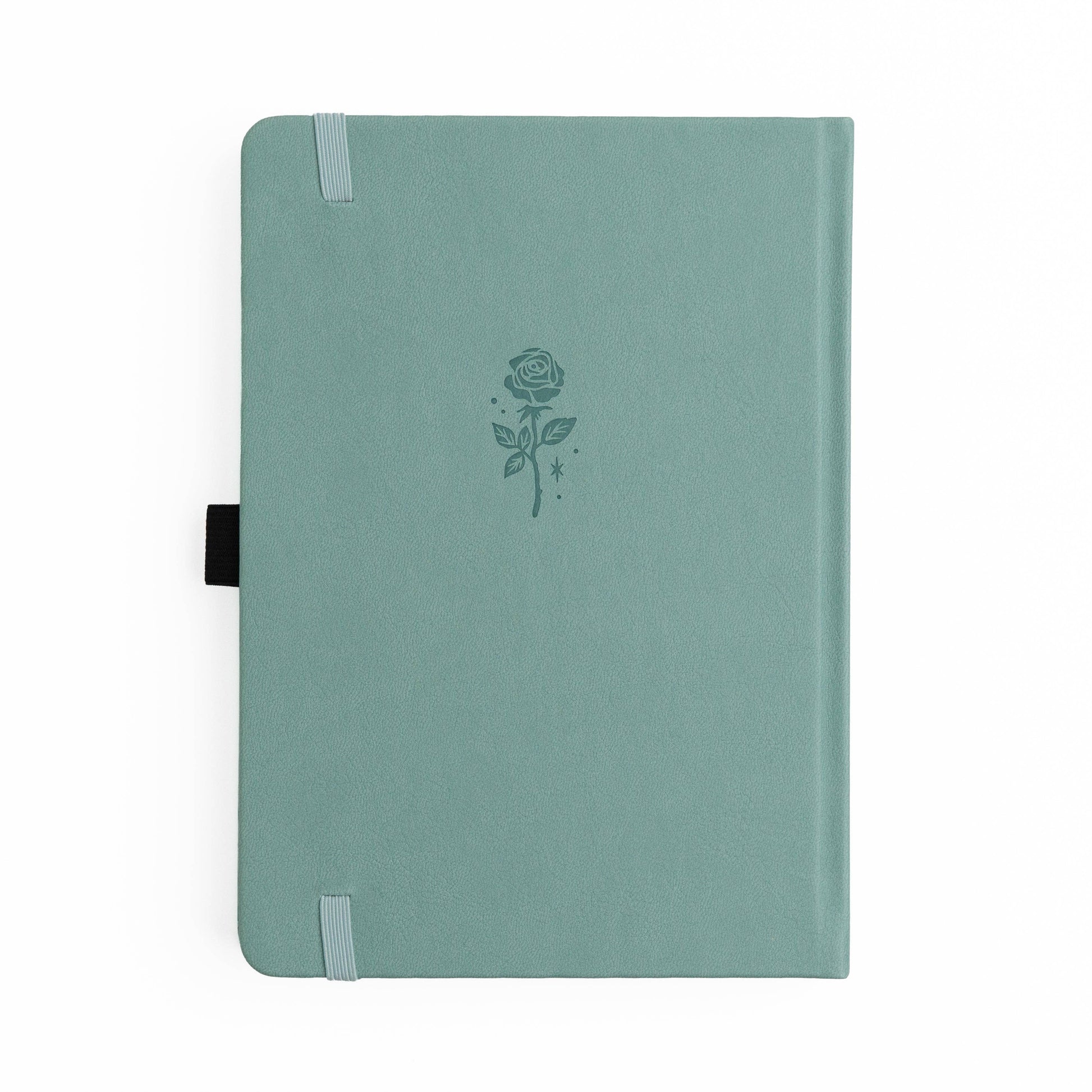 Green notebook with a rose design on a white background