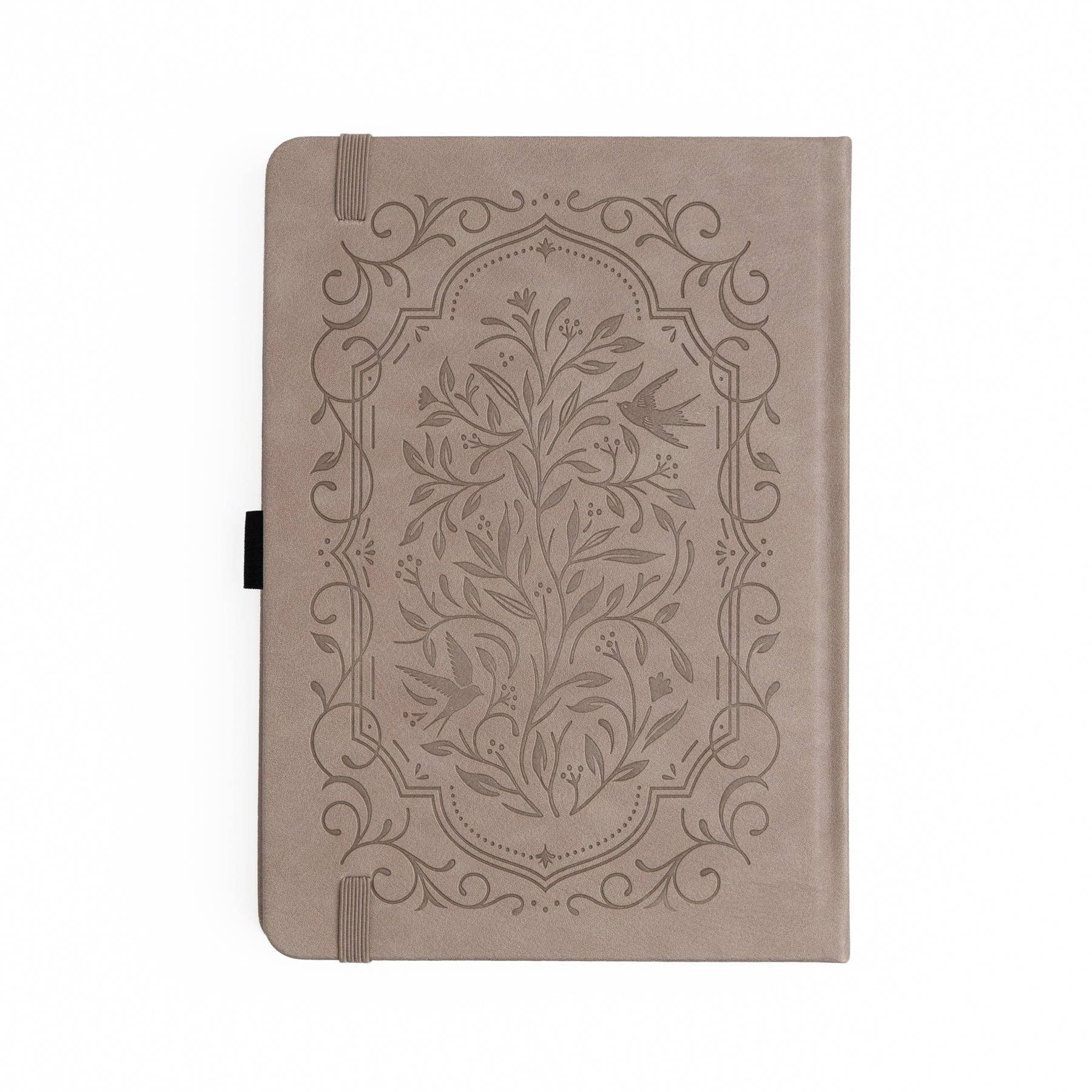 Beige notebook with floral embossed design on a white background